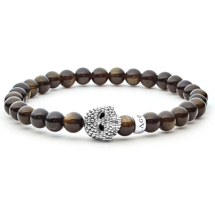 women's gemstone bangles -LAGOS Anthem Golden Obsidian Skull Bracelet in Sterling Silver