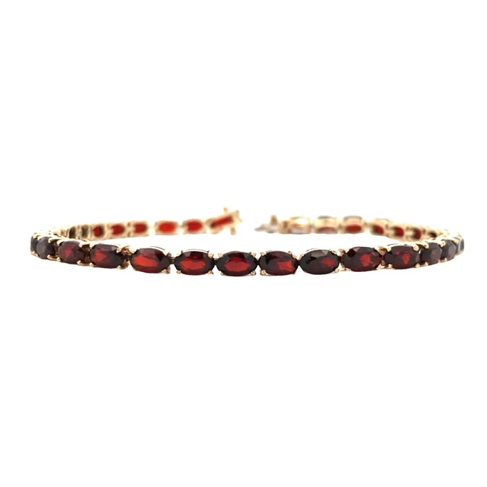 women's charm bracelet -Estate 7" Oval Garnet East/West Bracelet in 14K Yellow Gold